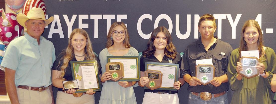 SeniOR aWaRD WinneRS – (from left) presenter Commissioner Harvey Berckenhoff; Kaylee Hensley, Gold Star; Tori Newton, Silver Star; Madeline Willrich, Silver Star; Railey Nieto, I Dare You; Elena Supak, I Dare You; and (not shown) Cooper Mau, Gold Star.