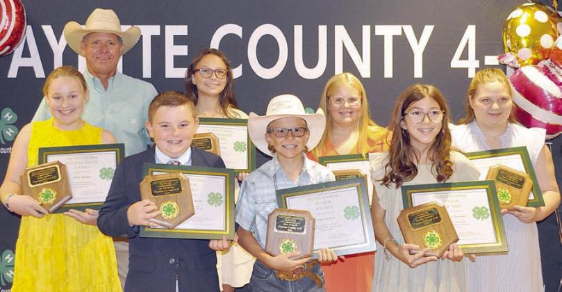 outStandinG JuniorS, interMediateS – (front row, from left) outstanding juniors Abraham McBride, Tate Fritsch and Taylyn Newton; (back row) outstanding intermediate Julia Melton; presenter Commissioner Harvey Berckenhoff; outstanding intermediates Tatum Fritsch, Addison Fryer and Brealey Nieto; and (not shown) outstanding junior Kaylyn Beseda.