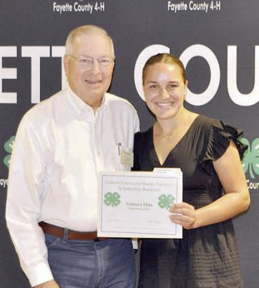 BlueBonnet MaSter Gardener and Gideon linCeCuM MaSter naturaliSt SCHolarSHiPS – (from left) presenter Ken English, Gideon Lincecum Master Naturalist; and Tamara Otto, recipient of both of the scholarships.