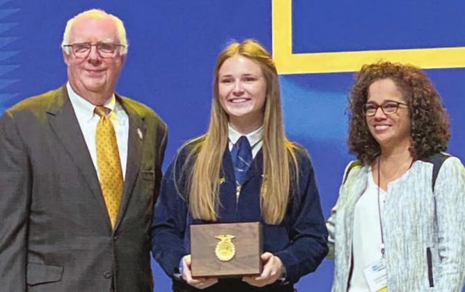 FORD SCHOLARSHIP – Taylor Limbaugh (center) received the $1,000 Ford Scholars Scholarship. Limbaugh was also recognized for achieving the Texas FFA Ford Scholar Program.
