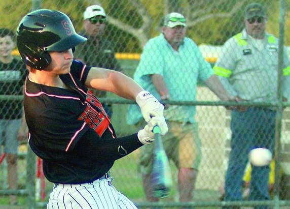 Emerson Harvey connects for an RBI-single in the fourth inning last Tuesday. Sticker Photo By Darrell Vyvjala