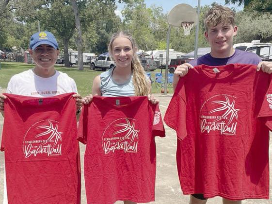 Three-point shooting contest winners – (from left) Jonathon Peterson, adult division; Jenna Guentert, youth female division; and Cole Collier, youth male division. Sticker Photo By Darrell Vyvjala