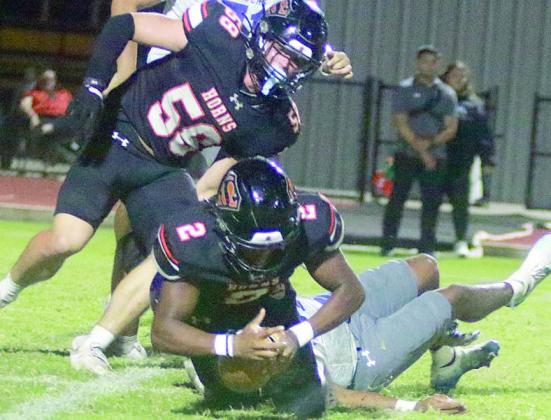 Mehki Wilson dives on a loose ball after he and Preston Kahn (No. 58) pressured Rice quarterback Kor’Dae Johnson to cause a fumble in the second quarter. Sticker Photo By Darrell Vyvjala