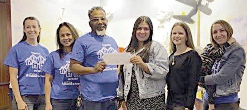 Colorado County Habitat fo r Humanity’s critical repair program recently received a grant from the Stanzel Family Foundation Inc. On hand for the check presentation were (from left) Casey Ring, Charmaine Katz and Kenneth Wicks, representing Colorado County Habitat for Humanity; Melanie Ramirez and Cheryl Pekar, representing Stanzel Family Foundation Inc.; and Adrienne Anderson holding her child Gideon, representing Colorado County Habitat for Humanity.