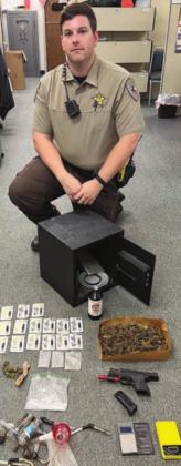 Drugs, firearms and other items were confiscated after Deputy Duane Meagher responded to a disturbance in the Swiss Alp area.