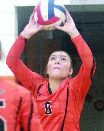 Greenli VanZandt reaches up save a deflected Lady Tiger attack in third set last Tuesday. Sticker Photo By Darrell Vyvjala