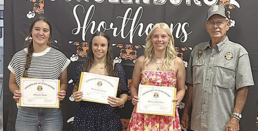 Vietnam Veterans of America Chapter 870 awarded scholarship certificates to (from left) Mikayla Stang, Myrannda Slaton and Heaven Hrachovy at the Schulenburg High School awards banquet on May 14. Each will receive $1,500 after submitting proof of registration to her respective college. The chapter awarded 14 scholarships to high school seniors this spring, each for $1,500. Scholarship committee member Eugene Krupala (right) made the presentations.