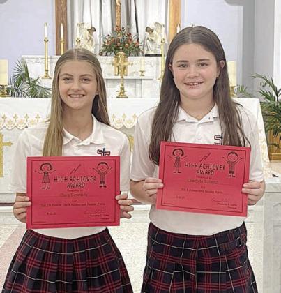 7th Grade Accelerated Readers – (from left) Clare Besetzny and Charlotte Schmidt.