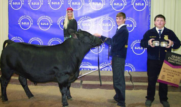 GRAND CHAMPION MARKET STEER – Exhibitor: Grant Kubala (second from right). Sales price: $10,000. Sticker Photo By Darrell Vyvjala