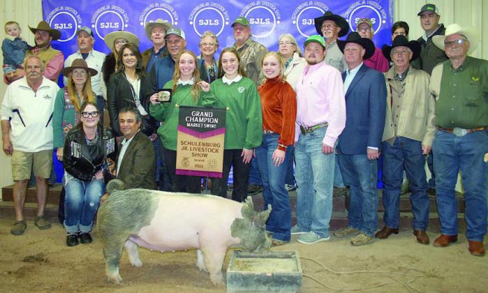 GRAND CHAMPION MARKET SWINE – Exhibitor: Tamara Otto (front, center). Sales price: $7,600. Sticker Photo By Darrell Vyvjala