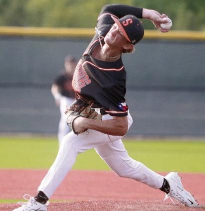 Connor Lichnovsky sends a pitch home to strike out a Lion in game one. Sticker Photo By Darrell Vyvjala