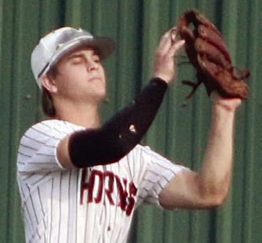 Emerson Harvey runs down a fly ball in right-centerfield in game two. Sticker Photo By Darrell Vyvjala