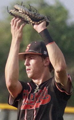 First baseman Van Prihoda catches a popup in foul territory in game one. Sticker Photo By Darrell Vyvjala