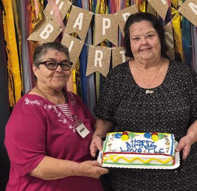 Birthdays – Senior Connections had 25 members with birthdays in September. Two present to help cut the cake were (from left) Carolyn Moore and Faye Smith.