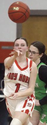Kaylee Beyer passes ahead to a teammate in the first half Friday. Sticker Photo By Darrell Vyvjala