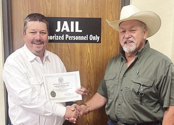 The Texas Commission on Jail Sta ndards issued a Certificate of Compliance to the Fayette County Jail, displayed by Jail Administrator Brad Neville (left) shown with Sheriff Keith Korenek (right).