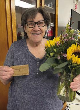 Blackout Bingo winner Carelie Ahlschlager won a lovely, live flower arrangement and a $10 gift card to Las Fuentes Mexican Restaurant in La Grange. Lillian Vanicek donated the gift card.