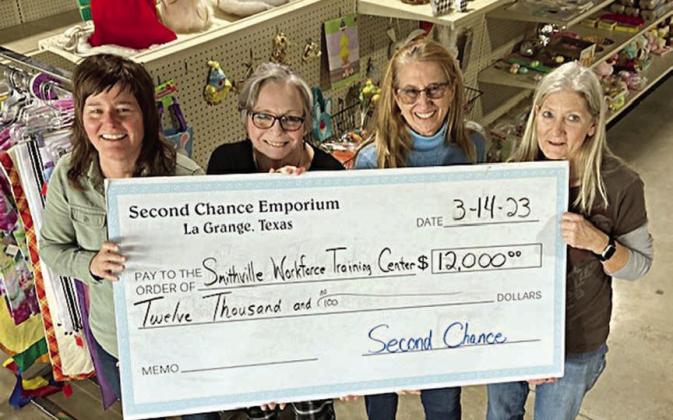 A $12,000 ch eck was presented by Second Chance Emporium to the Smithville Workforce Training Center for classes and training in Fayette County. Shown are (from left) Steph Smith, SWTC sustainability and county program director; Marjess Tovar, RN, county coordinator for Fayette County; Janice Bruno, county coordinator for Fayette County; and Gayle Schielack, Second Chance Emporium store director.