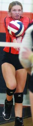 Michaela Kollmann sends a pass on its way in game one last Tuesday. Sticker Photo By Darrell Vyvjala