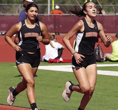 Makena Kopecky (right) and Ruby Rodriguez out-pace their competitors to finish first and second, respectively, in the 3200-meter run. Photo By Melanie Berger / Courtesy of Flatonia Argus