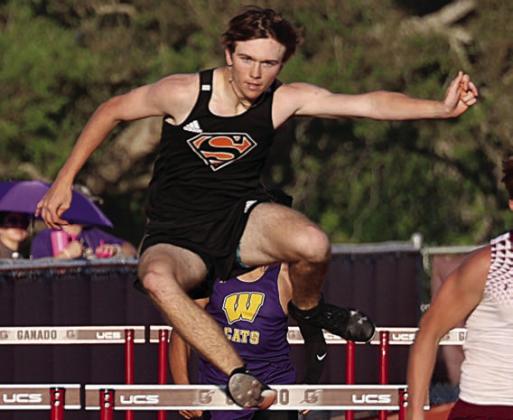 Nick Goode clears a hurdle in the 300-meter event on his way to a third-place finish. Photo By Melanie Berger / Courtesy of Flatonia Argus