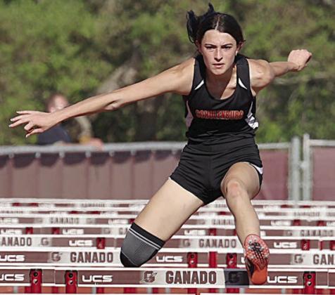 Ava Faith leaps over a hurdle in the 100-meter event en route to a secondplace finish. Photo By Melanie Berger / Courtesy of Flatonia Argus