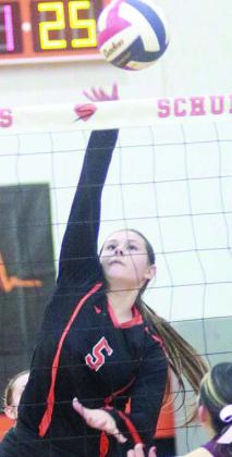 Haylee Vacek reaches high to send down her 25th kill and end the match against Flatonia. Sticker Photo By Darrell Vyvjala