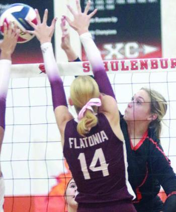 Reagan Dusek directs a kill cross-court in the first set Friday. Sticker Photo By Darrell Vyvjala