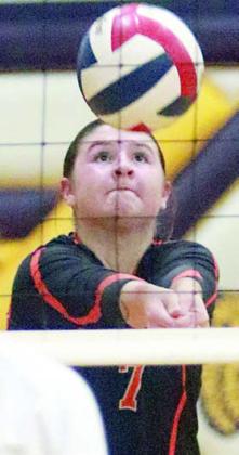Landry Zapalac saves a ball near the net in the third set against Weimar. Sticker Photo By Darrell Vyvjala