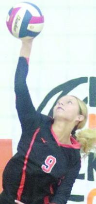 Michaela Kollmann serves an ace to put the Lady Horns up 13-4 in game one on Friday. Sticker Photo By Darrell Vyvjala