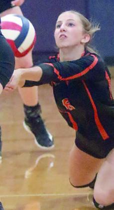Clara Magliolo makes a diving dig in the first set last Tuesday. Sticker Photo By Darrell Vyvjala