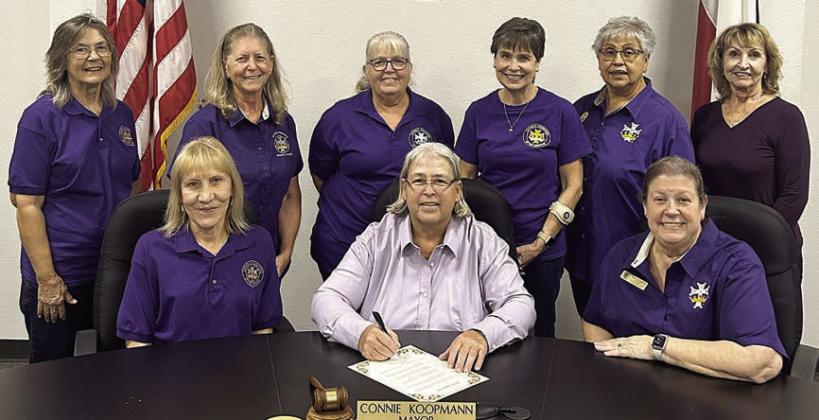 A proclamat ion-signing was held declaring Sunday, Oct. 20 as National Catholic Daughters Day. On hand were (front row, from left) vice regent Phyllis Venghaus, Mayor Connie Koopmann who signed the document, regent Grace Lebeda, (back row) Barbara Veselka, Wanda Doubrava, recording secretary Phyllis Valchar, Peggy Kalich, district deputy Rosa Galipp and treasurer Veronia Smith.