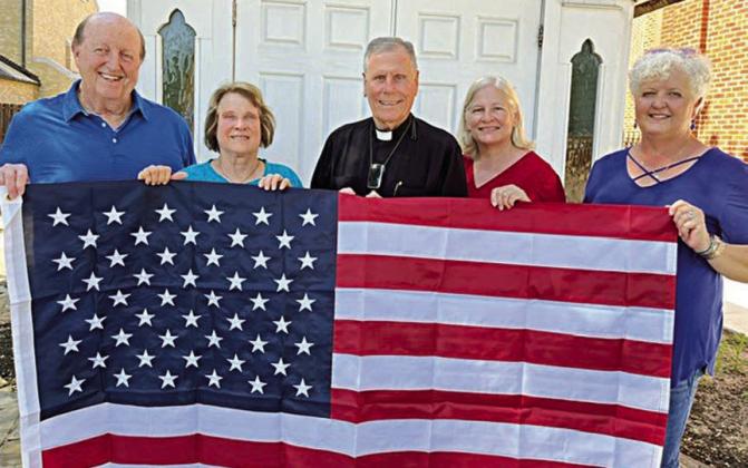 Catholic Life gives flag to St. Rose