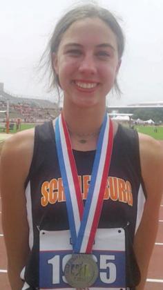Meredith Magliolo poses with her silver medal at Mike A. Myers Stadium. Sticker Photo By Darrell Vyvjala