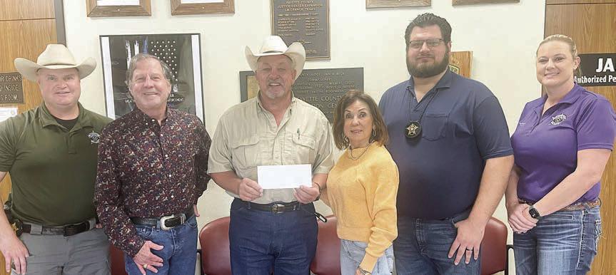Polka Lovers Club of Texas Museum officers and Fayette County Sheriff’s Department personnel were on hand as the PLCTM presented a donation to the Deputy Santa Program. Shown are (from left) Kenn Kretz, deputy investigator; Gary Bucek, PLCTM president; Keith Korenek, Fayette County sheriff; Carol Artz-Bucek, PLCTM secretary|treasurer; Jeremy Castleberry, deputy investigator; and Angela Lala, FCSO sergeant.