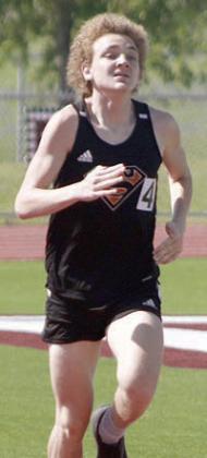 Alton Herzik competes in the 3200-meter run. Sticker Photo By Darrell Vyvjala