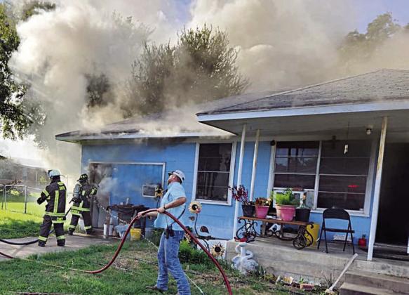 SVFD firefighters battle the house fire in the 100 block of Baumgarten Street last Wednesday. Photo Courtesy of the SVFD