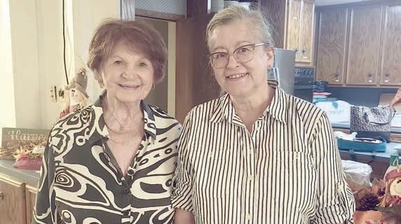 New members welcomed into the Garden Cub were (from left) Lily Hilscher and Karen Miley.