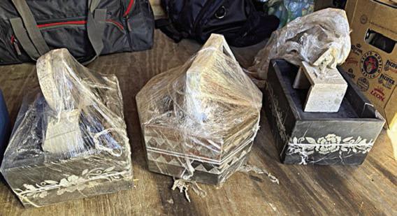 Decorative water fountains being hauled in the trailer were used to conceal the three bundles of cocaine.