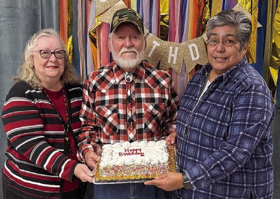 Birth days – Out of 27 members celebrating birthdays in February, these three braved the ice-cold temperatures to get a slice of cake brought by Cynthia Trojacek. Shown are (from left) Kitra Ruiz and her husband Steve, and Cindy Villarreal. All of the birthday honorees will receive a birthday card signed by many members to brighten their day.