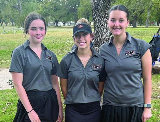 Lady Horns who competed in the Sacred Heart Tournament were: (from left) Cheyenne Henneke, Brennan Chudej, and Molly Rorschach.