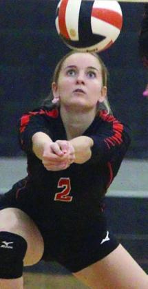 Madison Kunschick gets a dig in the third set against Weimar. Sticker Photo By Darrell Vyvjala