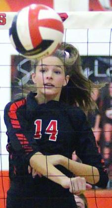 Emmrie Marx sends down a kill in game one last Friday. Sticker Photo By Darrell Vyvjala