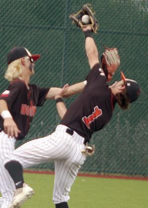 Second baseman Cooper Demel snags a popup in the bottom of the third inning of the Horns’ win Saturday as he and shortstop Connor Lichnovsky chased it down in shallow centerfield. Sticker Photo By Darrell Vyvjala