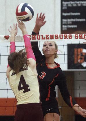 Aubryn Janda sends down the final point of game one in the Lady Horns’ win at home last week. Sticker Photo By Darrell Vyvjala