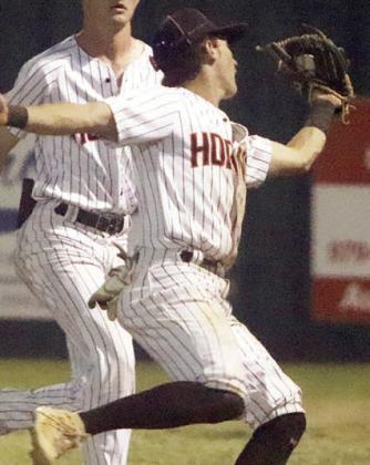 Second baseman Cooper Demel makes an acrobatic catch of a looping fly ball in shallow right field on Friday. Sticker Photo By Darrell Vyvjala