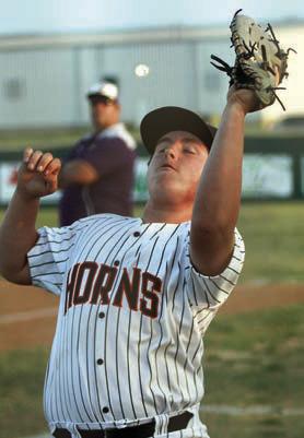 First baseman Ian Reeves catches a popup on the run near the fence in the Horns’ home game last week. Sticker Photo By Darrell Vyvjala