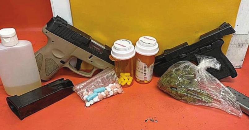 The guns, drugs, and fake urine that were confiscated by the Schulenburg Police Department following a traffic stop on Interstate 10 on Sunday, July 31.