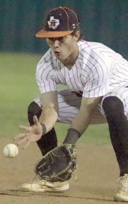 Second baseman Cooper Demel looks a grounder into his glove for an out in the top of the seventh inning Friday night. Sticker Photo By Darrell Vyvjala