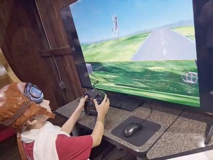 Navigating the obstacle course challenge in the Flight Simulator is Waylon Neskora.